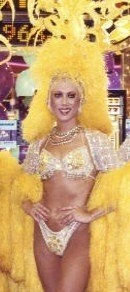 Las Vegas showgirl performer in yellow feathered costume